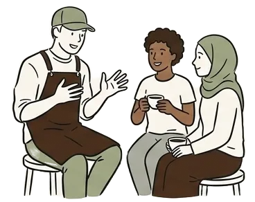 Menschen sitzen im Kreis mit Kaffeetassen in der Hand
